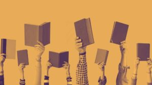 Hands holding books