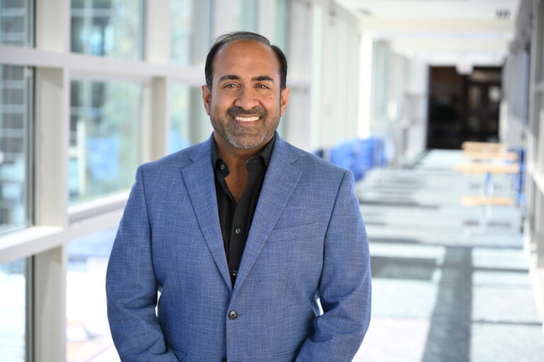 Rohit-HEADSHOT-Standing-with-suit-jeans-HORIZONTAL